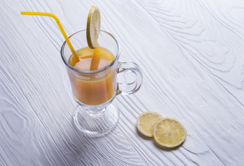 orange juice, drinking straw yellow, lemon slices