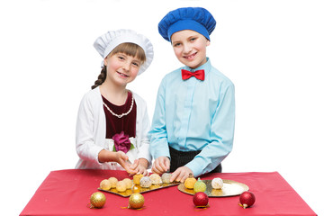 Children cooking christmas dessert