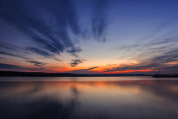 Fototapeta na wymiar Stunning lake sunset with reflection