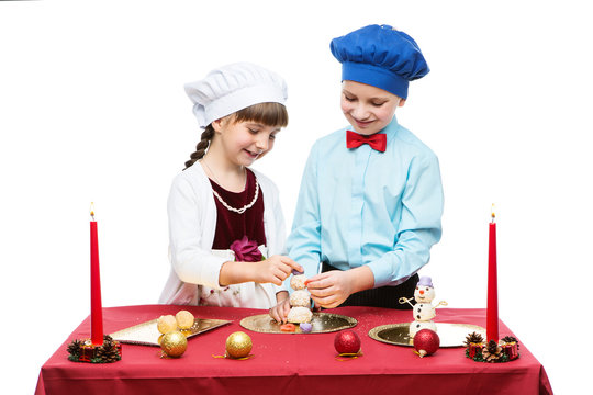 Children cooking christmas dessert