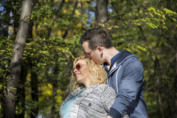 Young pregnant couple in the park