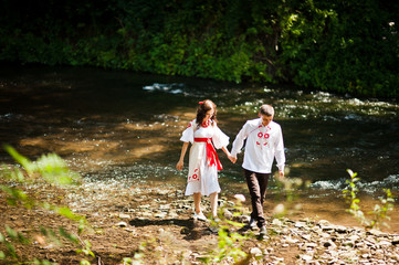 Love story of loving couple in national Ukraine dress. Near the