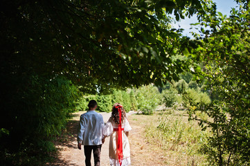 Love story of loving couple in national Ukraine dress.