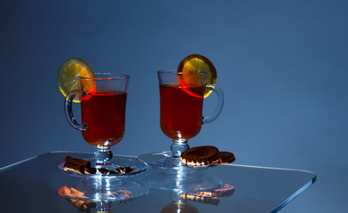 Cup of green tea with cinnamon and spices. With lemon