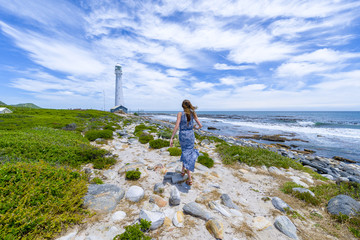 Woman walking on tropical beach paradise