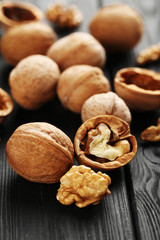 Walnuts on a black wooden table