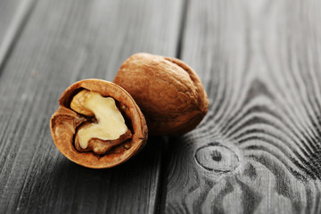 Walnuts on a black wooden table