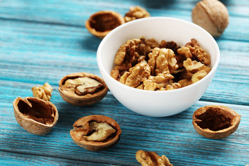 Walnuts on a blue wooden table