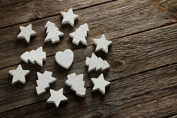 Decorative heart, stars and fir-tree on a grey wooden background