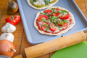 Freshly baked artisan pizza with fresh produce and cheese.