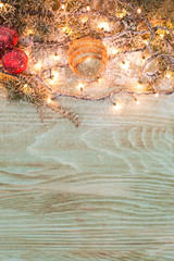 Christmas fir tree with snowfall on a wooden board