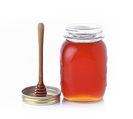Bottle honey,spoon on white background