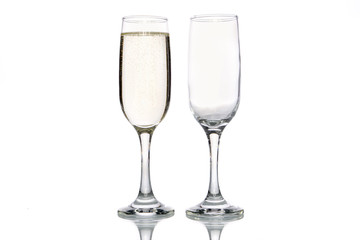 Glass of champagne and empty champagne glass