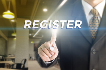 A Businessman holding a white sign with the message REGISTER. Can bring to the medium of your ad.