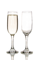 Glass of champagne and empty champagne glass