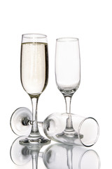 Glass of champagne and empty champagne glass