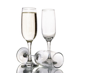 Glass of champagne and empty champagne glass