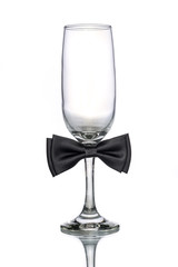empty champagne glass with bow tie