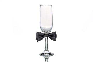 empty champagne glass with bow tie