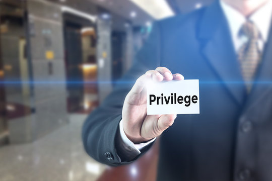 Business man pressing hand Privilege word on virtual screen