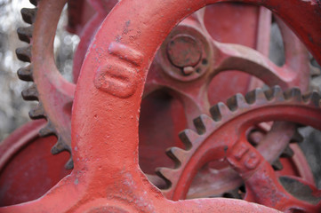  A collection of red gears with the number ten