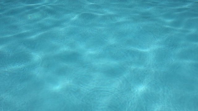 Blue ripped water in swimming pool
