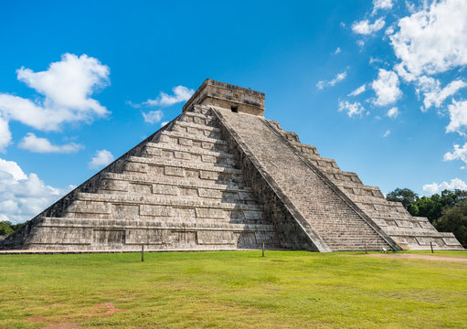 Famous mayan pyramid Chichen Itza in sunlight with nobody around in Mexico