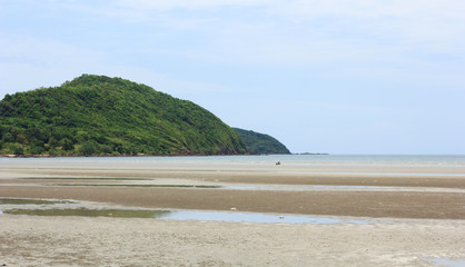 Mountains with blue sea and blue sky .