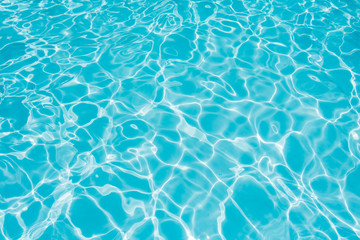 Blue and bright water surface in swimming pool