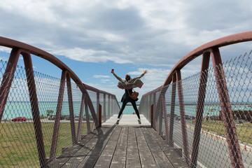 woman jump on the bridge - 98483770
