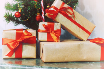 stack of gifts under a Christmas tree