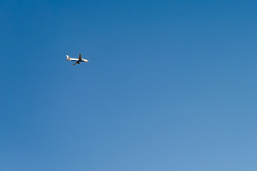 Airplane On Clear Blue Summer Sky