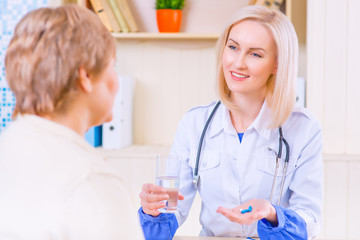 Pleasant nurse speaking with her patient 