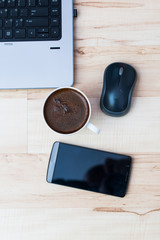 laptop, smartphone, mouse and coffee