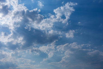Fototapeta na wymiar sunbeam through the clouds of sunlight in blue sky background