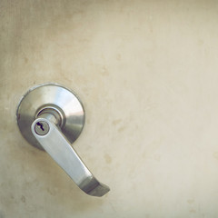 metallic steel knob door handle lock the old white door