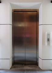 modern metal elevator close door in building office