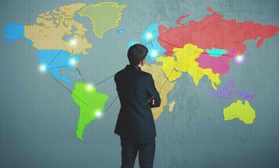businessman drawing map on wall