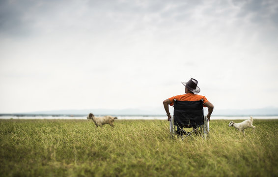 One man alone sitting in a wheel chair