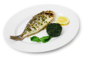 Grilled sea bass with spinach garnish.
