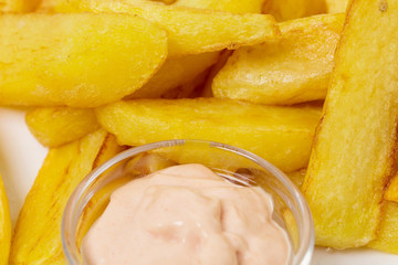 Delicious potato wedges with sauce. 