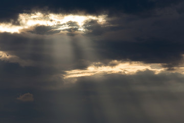 ray light of sun through cloud