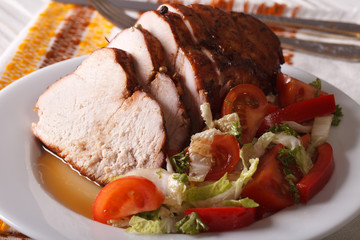 roasted turkey breast and fresh vegetables closeup. Horizontal
