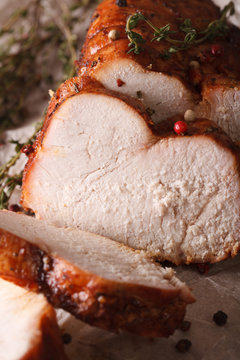 Roasted turkey fillet with thyme and spices macro. vertical
