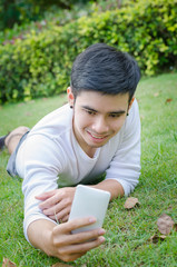 Man taking a selfie with his smart phone outdoor