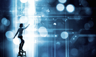 Businesswoman touching icon on screen