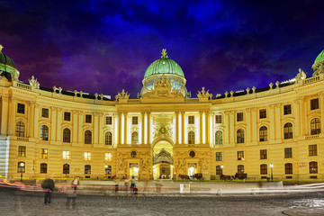 Fototapeta na wymiar Hofburg Palace seen from Michaelerplatz, wide-angle view at dusk