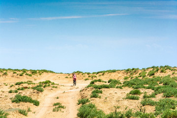 Biking through the sandy roads.