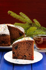 Chocolate fruit christmas cake with green fur tree branch