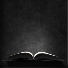 Old book in darkness